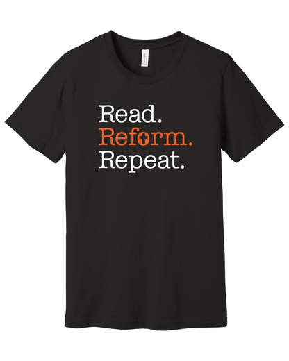 Black Bella+Canvas t-shirt with white typewriter-style text reading Read. Reform. Repeat., with Reform. in orange and a cross in the letter o